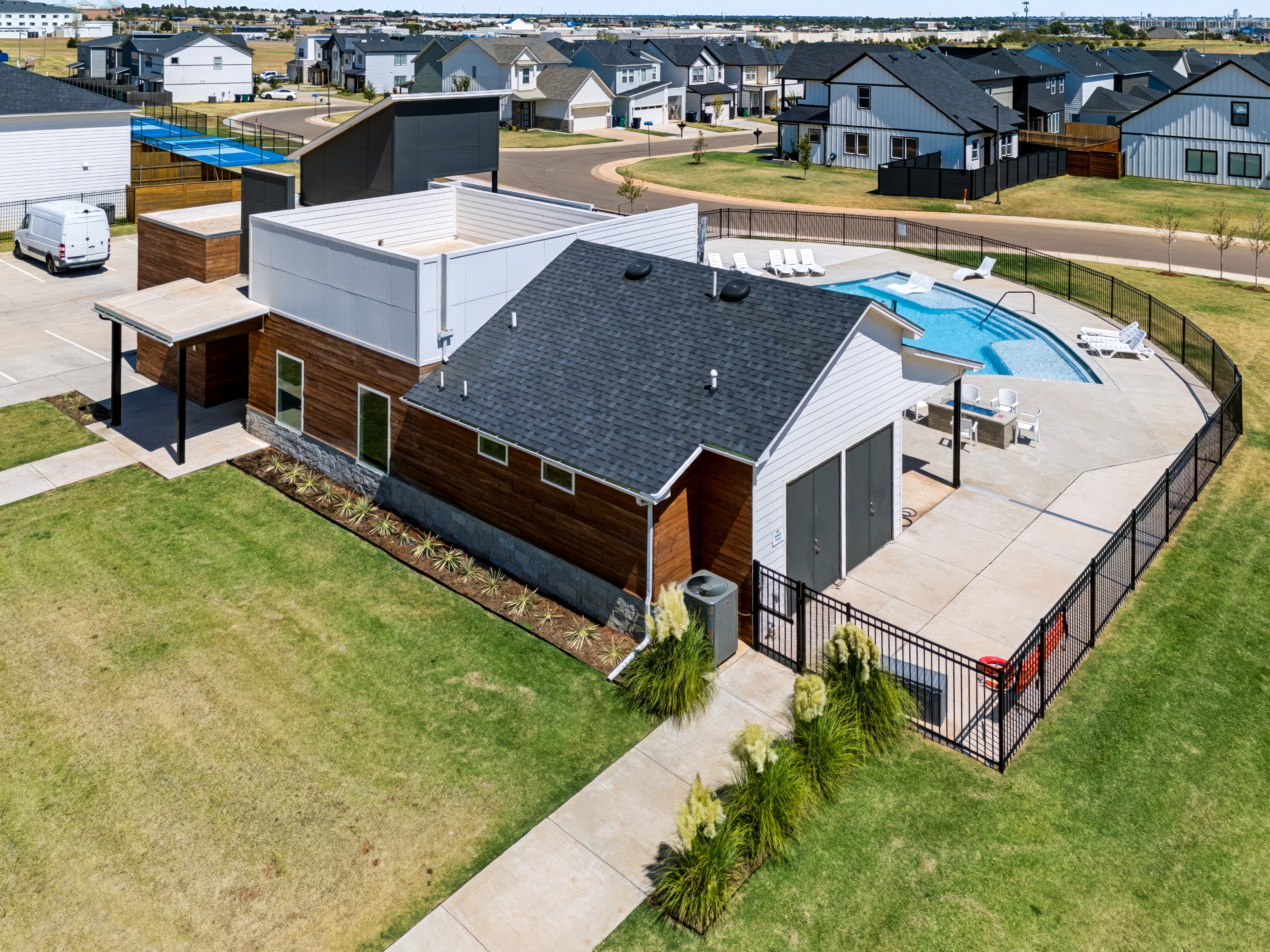 Aerial view of modern home with outdoor amenities
