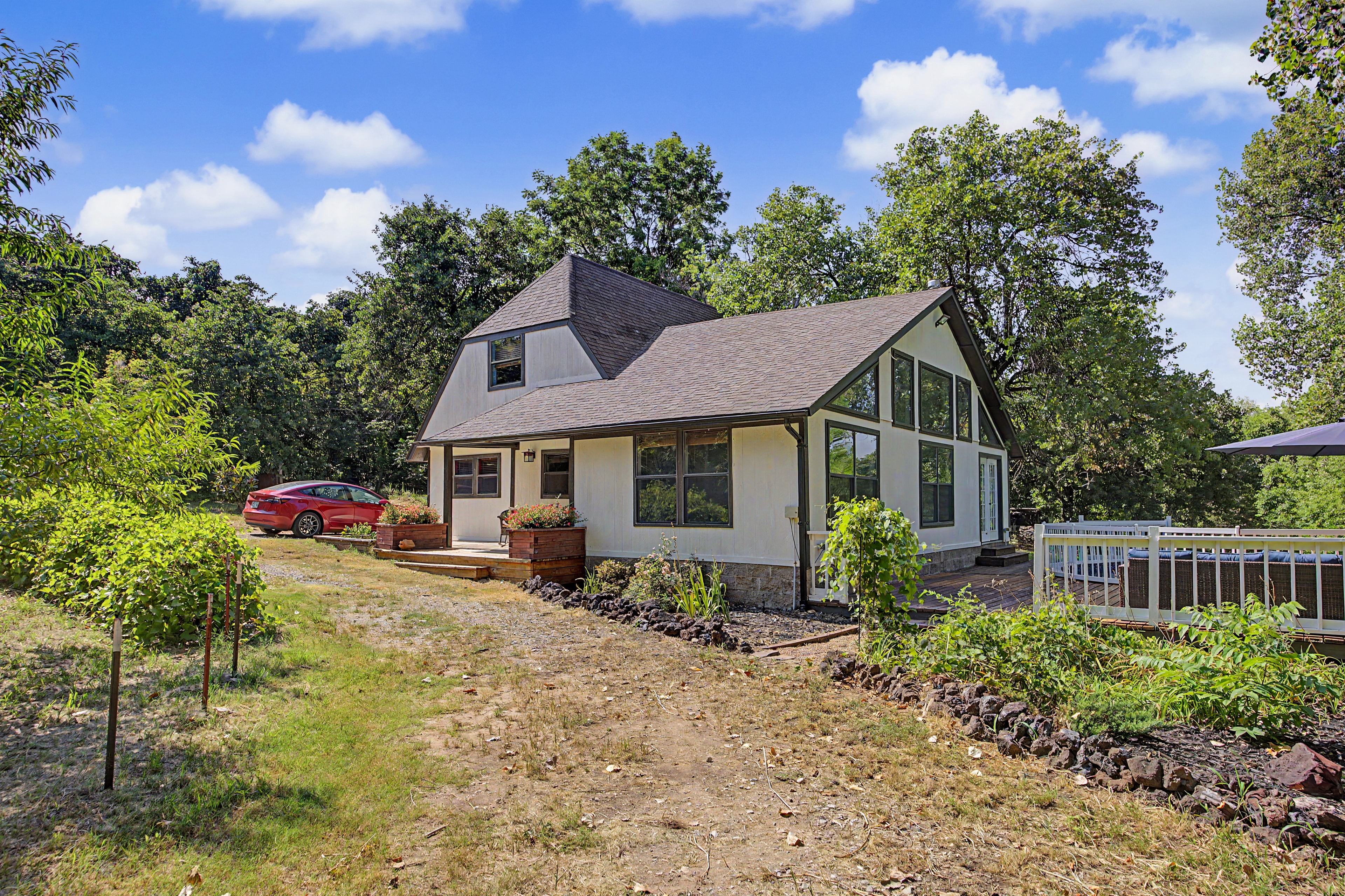 Contemporary home exterior with large windows at 18805 SE 89th St