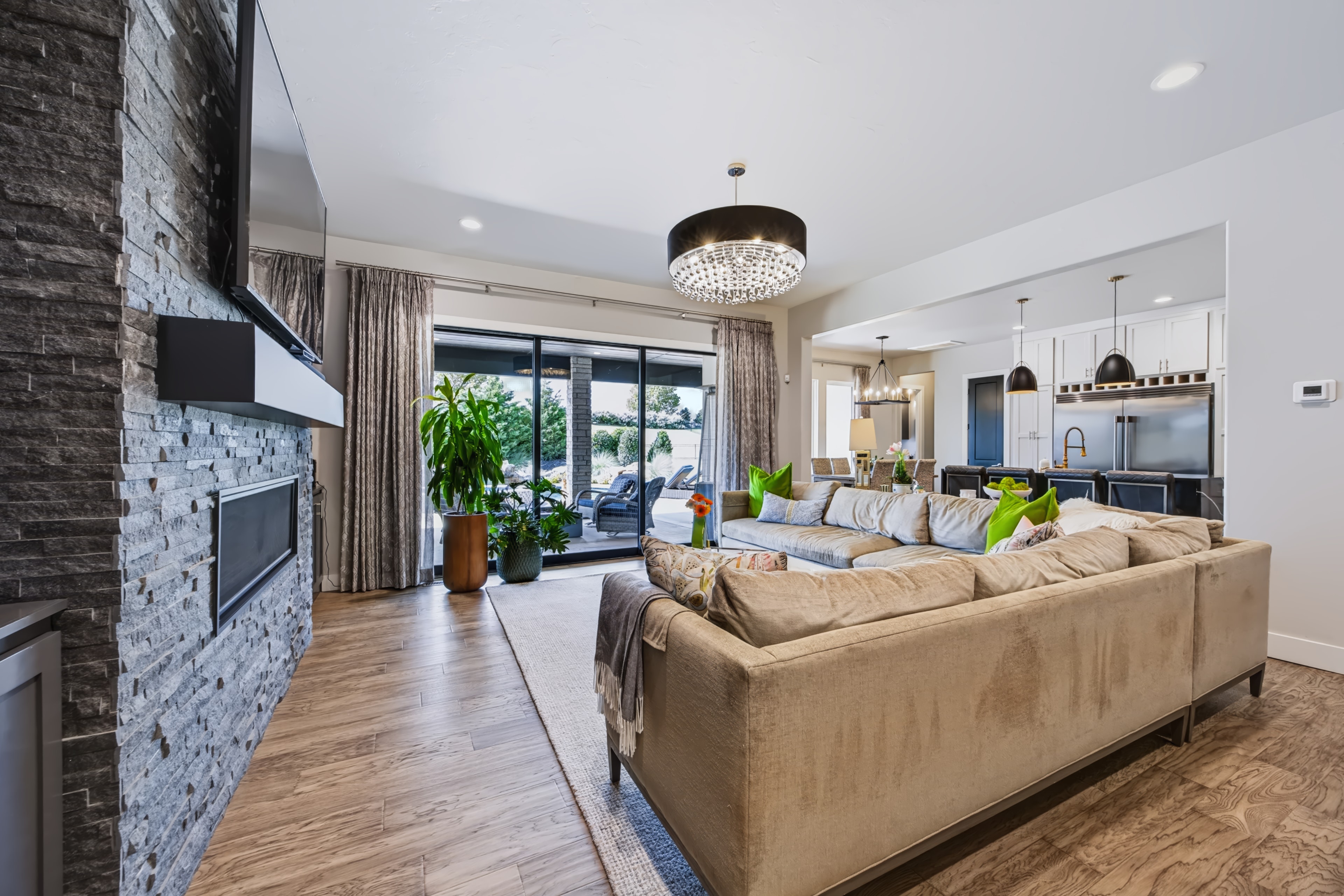 Open-concept living and kitchen space with modern furnishings at 21458 S Sawtooth Cir